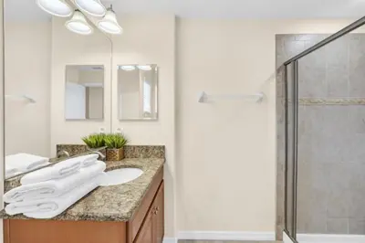 a bathroom with a sink and a shower at Spacious 5 Bedroom Villa for Families 6337 in Kissimmee