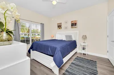 a bedroom with a bed and a window at Tranquil Villa Retreat with Mountain Views 6338 in Kissimmee