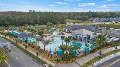 an aerial view of a pool at a resort at Rent the Perfect 8 Bedroom Villa on Storey Lake Resort Orlando Villa 6293 in Kissimmee