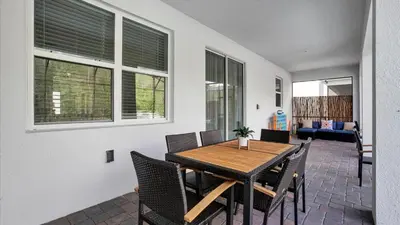 a dining room with a table and chairs at Rent the Perfect 8 Bedroom Villa on Storey Lake Resort Orlando Villa 6293 in Kissimmee