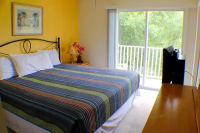 a bedroom with a bed and a large window at 5-Star Orlando Townhome 6423 - Resort Amenities Near Disney in Kissimmee