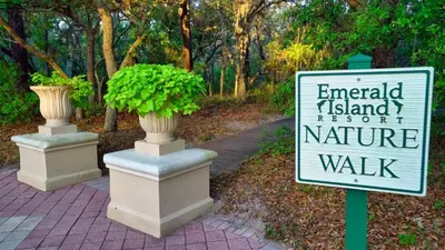 a sign that says emerald island resort and nature walk at 5-Star Orlando Townhome 6423 - Resort Amenities Near Disney in Kissimmee