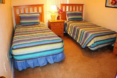 two beds sitting next to each other in a bedroom at 5-Star Orlando Townhome 6423 - Resort Amenities Near Disney in Kissimmee