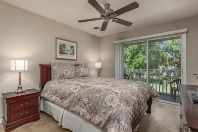 a bedroom with a bed and a ceiling fan at Orlando 6424 Townhome: Family Fun Close to Disney in Kissimmee