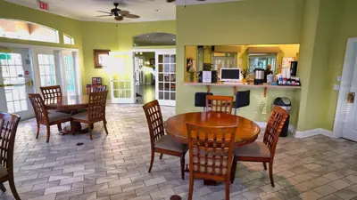 a dining room with a table and chairs at Luxury Orlando Townhome 6425 - Emerald Island Resort Stay in Kissimmee