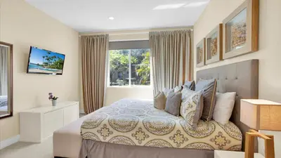 a bedroom with a large bed and a window at Book Now: Orlando Townhome 6440 Near Disney Magic in Orlando