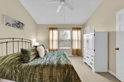 a bedroom with a bed and a ceiling fan at Orlando Townhome 6442 - Private Pool Club Access in Orlando
