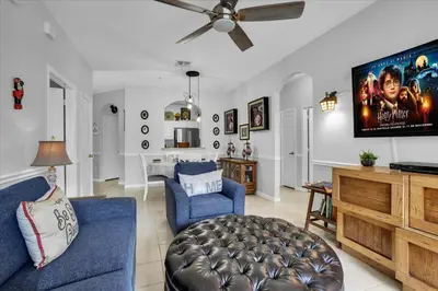 a living room with a couch and a tv at Orlando Condo 6445: Family Fun Near Disney in Kissimmee