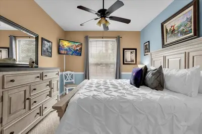 a bedroom with a bed and a ceiling fan at Orlando Condo 6445: Family Fun Near Disney in Kissimmee