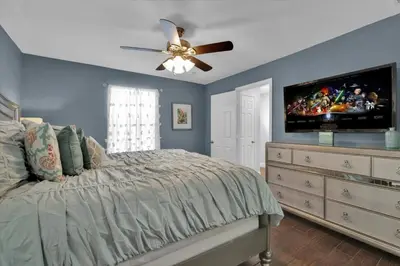 a bedroom with a bed and a ceiling fan at Orlando Villa 6472 - Family Getaway Home in Orlando
