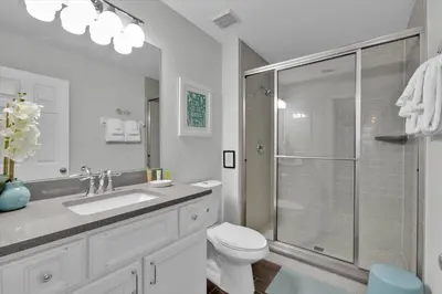 a bathroom with a shower and a toilet and a sink at Orlando Villa 6472 - Family Getaway Home in Orlando