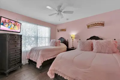 a bedroom with two beds and a ceiling fan at Orlando Villa 6472 - Family Getaway Home in Orlando