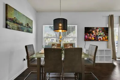 a dining room with a table and chairs at Orlando Townhome 6458: Perfect Base for Your Disney Trip in Kissimmee
