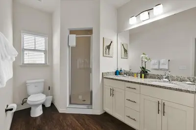 a bathroom with a toilet and a sink and a shower at Orlando Townhome 6458: Perfect Base for Your Disney Trip in Kissimmee