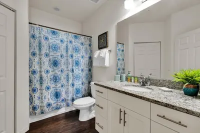 a bathroom with a toilet and a sink at Orlando Townhome 6458: Perfect Base for Your Disney Trip in Kissimmee