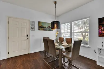 a dining room with a table and chairs at Orlando Townhome 6458: Perfect Base for Your Disney Trip in Kissimmee