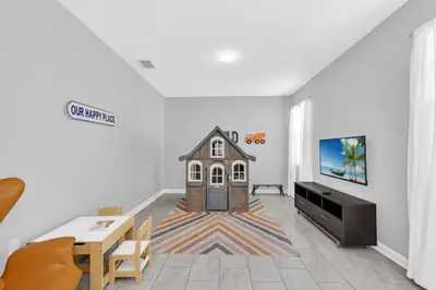 a living room with a house on the floor at You and Your Family will Love this Luxury Villa on Storey Lake Resort Orlando Villa 6295 in Kissimmee