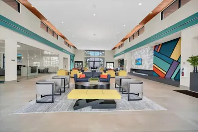 an office lobby with a yellow table and chairs at Orlando Villa 6401 - Dream Stay at Paradiso Resort in Orlando