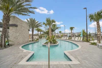 a swimming pool at a resort with palm trees at Orlando Villa 6401 - Dream Stay at Paradiso Resort in Orlando