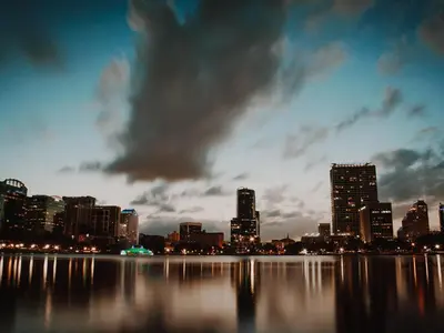 a view of a city skyline at night at Picture Renting Your Own Luxury Villa on the Exclusive Paradiso Grande Resort close to Disney Orlando Villa 6402 in Orlando