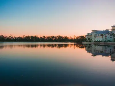 a large body of water with houses and buildings at The Secret to Enjoying the Best Orlando Villa Holiday while Staying on Paradiso Grande Resort Orlando Villa 6409 in Orlando