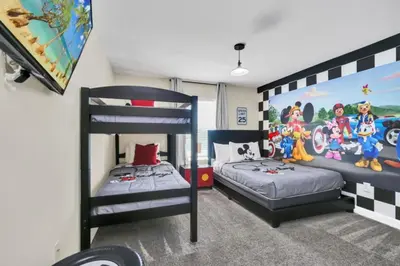 a bedroom with two bunk beds and a mural at Experience Luxury at Orlando Villa 6231 Storey Lake in Kissimmee