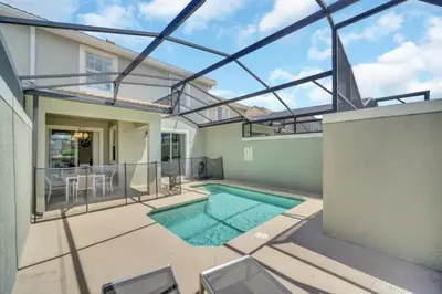 a swimming pool in a house with a glass ceiling at Experience Luxury at Orlando Villa 6231 Storey Lake in Kissimmee