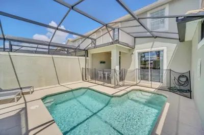 a swimming pool in the middle of a house at Experience Luxury at Orlando Villa 6231 Storey Lake in Kissimmee