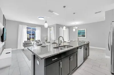 a kitchen with a sink and a counter top at Orlando Villa 6247: Relax in Style at Storey Lake Resort in Kissimmee