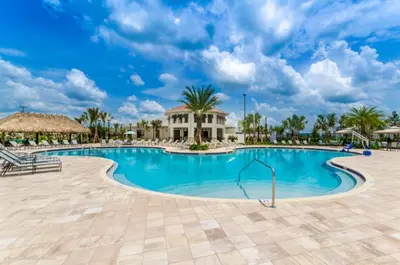 a pool at the resort with palm trees at Orlando Villa 6247: Relax in Style at Storey Lake Resort in Kissimmee