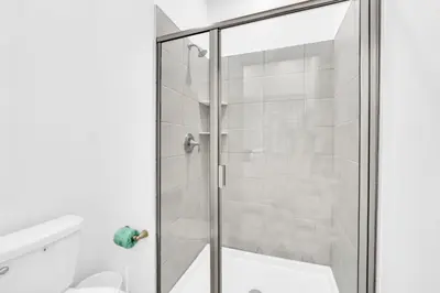 a shower with a glass door in a bathroom at Luxury Villa at Storey Lake Resort Near Disney – Orlando Villa 6253 in Kissimmee