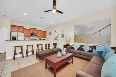 a living room with a couch and a table at Orlando Villa 6256: Experience 5-Star Luxury at Paradise Palms Resort in Kissimmee