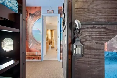 a hallway in a house with a door open at Luxury Villa with private Pool Emerald Island Resort Orlando Villa 5074 in Kissimmee