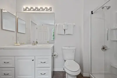 a white bathroom with a sink and a toilet at Luxury Villa with private Pool Emerald Island Resort Orlando Villa 5074 in Kissimmee