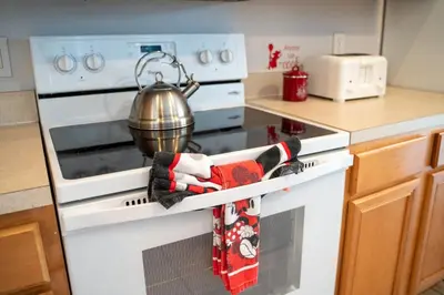 a kitchen with an oven with a pot on it at Luxury Villa with private Pool Emerald Island Resort Orlando Villa 5074 in Kissimmee