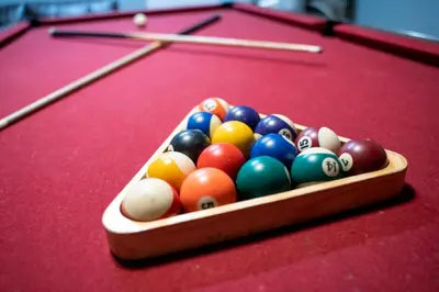 a tray of billiard balls on a pool table at Luxury Villa with private Pool Emerald Island Resort Orlando Villa 5074 in Kissimmee