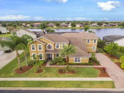 an aerial view of a house with palm trees at 5 Star Mansion with Private Pool on Formosa Gardens Orlando Manion 5075 in Orlando