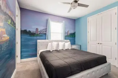 a bedroom with a bed with blue walls and a ceiling at Exclusive Mansion with Large Private Pool on Veranda Palms Orlando Mansion 5378 in Kissimmee