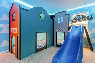 a kids room with a slide and bunk beds at Beautiful Mansion with first class amenities on Solara Resort Orlando Mansion 5715 in Orlando
