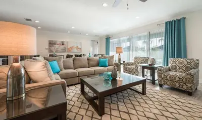 a living room with a couch and a table at Dive into Luxury and Fun at Your Orlando Paradise in Orlando