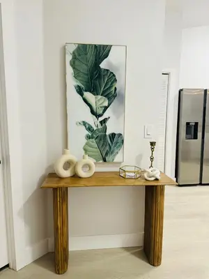 a table in a room with a picture on the wall at Family stay Near Disney in Kissimmee