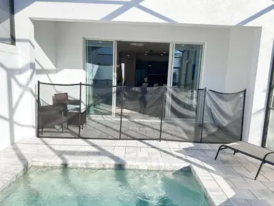 a swimming pool in the middle of a house at TR1391 – 4 Bedrooms Home with pool near Disney in Clermont