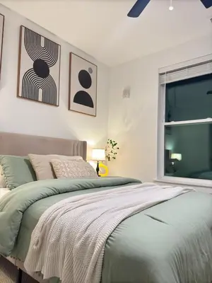 a bedroom with a bed and a window at Modern 1 bedroom Apartment and Den in Orlando in Orlando