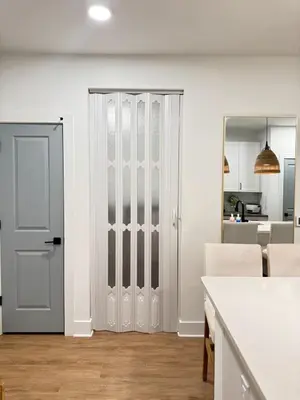 a white door in a room with a kitchen at Modern 1 bedroom Apartment and Den in Orlando in Orlando