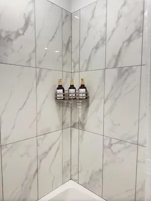 a bathroom with three bottles of wine on a wall at Modern 1 bedroom Apartment and Den in Orlando in Orlando