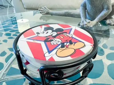 a glass table with mickey mouse on top of it at Indian Ridge Home w/ Private Pool & Game Room near Disney in Orlando