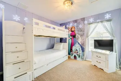 a childs bedroom with bunk beds and a disney princess mural at 3 Mi to Disney Family-Friendly Home! in Orlando