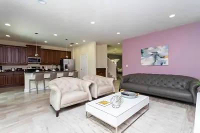 a living room with a couch and a table at 421 NP - Exquisite Retreat at Encore Resort in Orlando