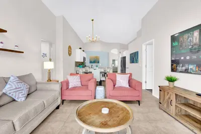 a living room with a couch and two chairs and a table at Stunning Emerald Island Resort Vacation Home with Pool Spa and Access to Clubhouse in Kissimmee