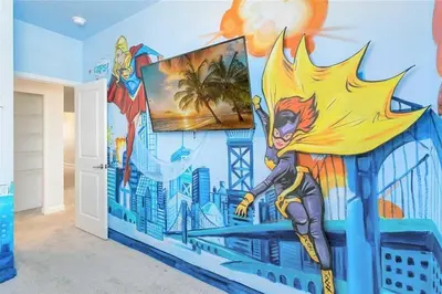 a room with a superhero mural on the wall at Fantastic Home 7BR5BA with Private Pool Storey Lake Resort SL2648 in Kissimmee